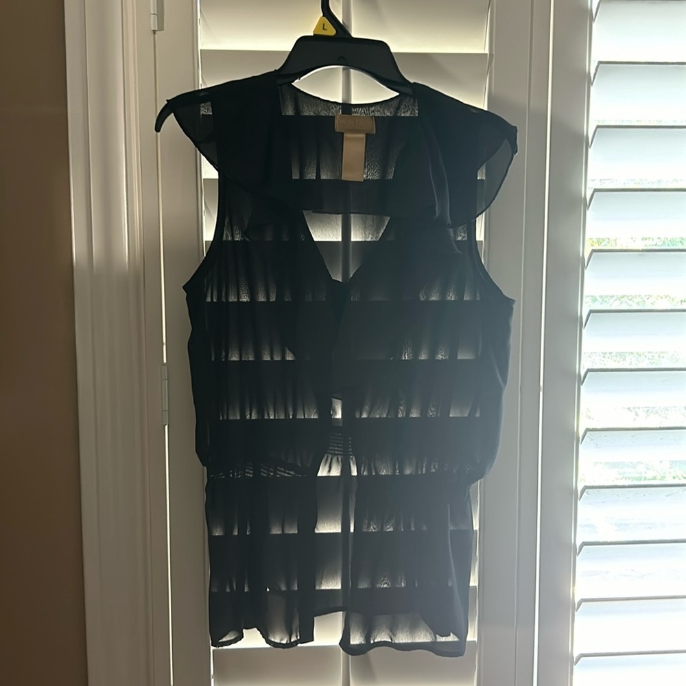Tina Knowles button down sleeveless blouse